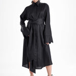 Black maxi shirt dress worn by a model from the front, showcasing the belted waist and relaxed fit