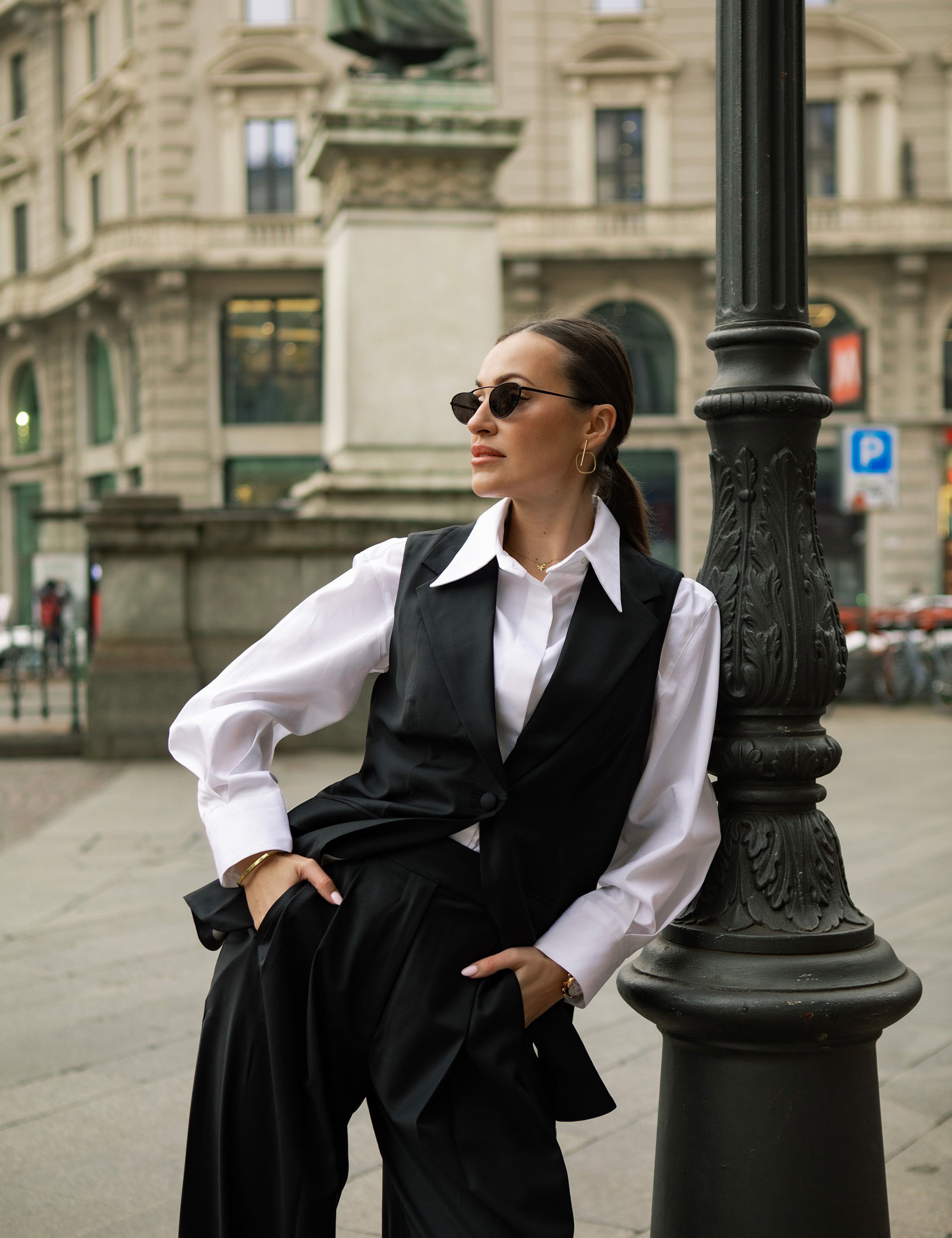 Luxury Italian white business shirt worn by a model with a relaxed fit and concealed button fastening