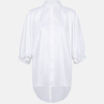 Organic cotton white shirt shown without a model, featuring puff sleeves, a curved hem and a concealed button placket