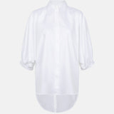 Organic cotton white shirt shown without a model, featuring puff sleeves, a curved hem and a concealed button placket