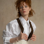 Relaxed-fit white cotton business shirt worn by a model with dropped shoulders and a modern silhouette