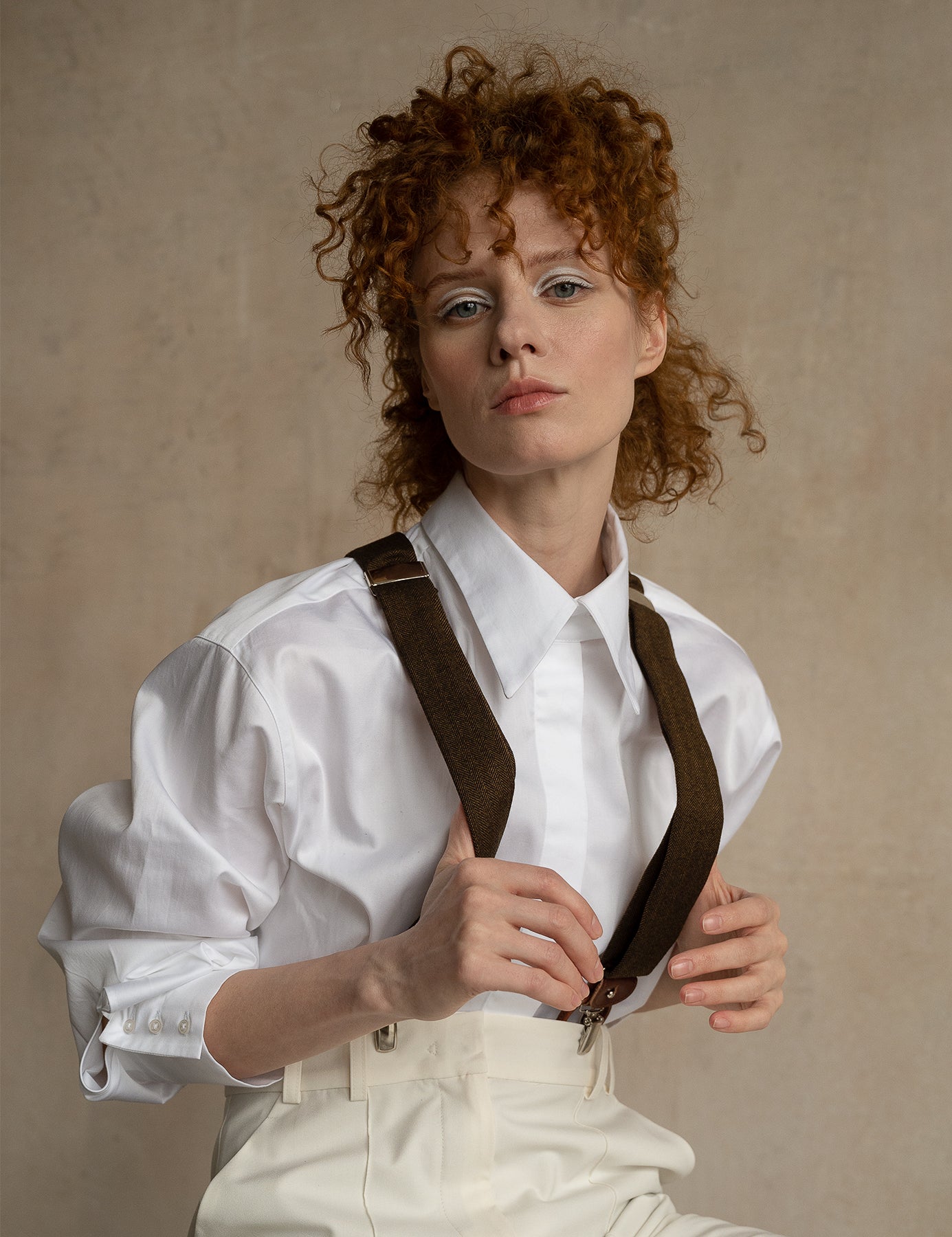 Relaxed-fit white cotton business shirt worn by a model with dropped shoulders and a modern silhouette