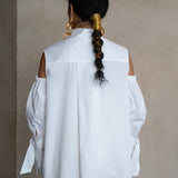 Split-back collar white cotton gabardine shirt with relaxed silhouette and cold-shoulder detailing, rear view on a model