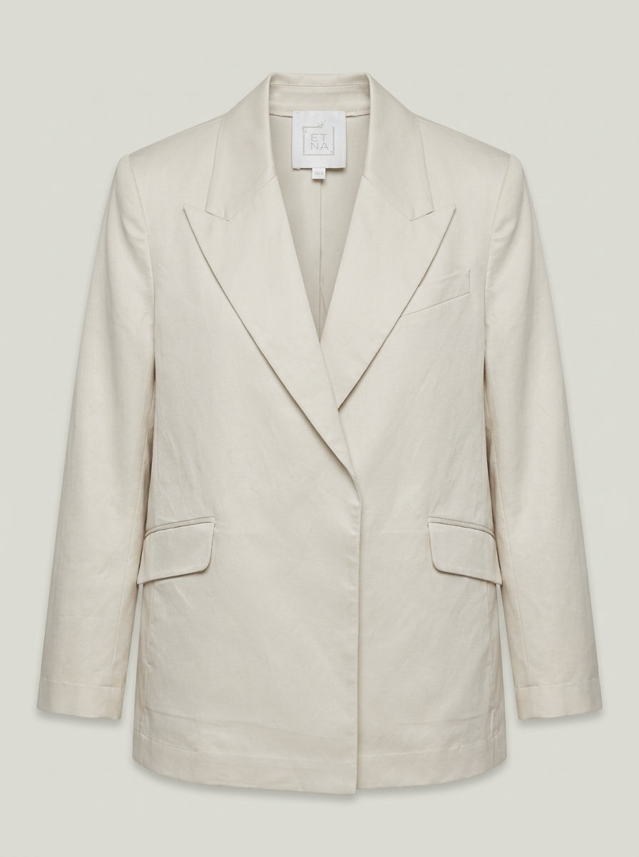 Tailored sand linen-blend jacket with peaked lapels, flap pockets and structured shoulders, front product view
