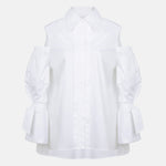 White cotton gabardine shirt with cold-shoulder design, puff sleeves and elongated relaxed fit, front product view